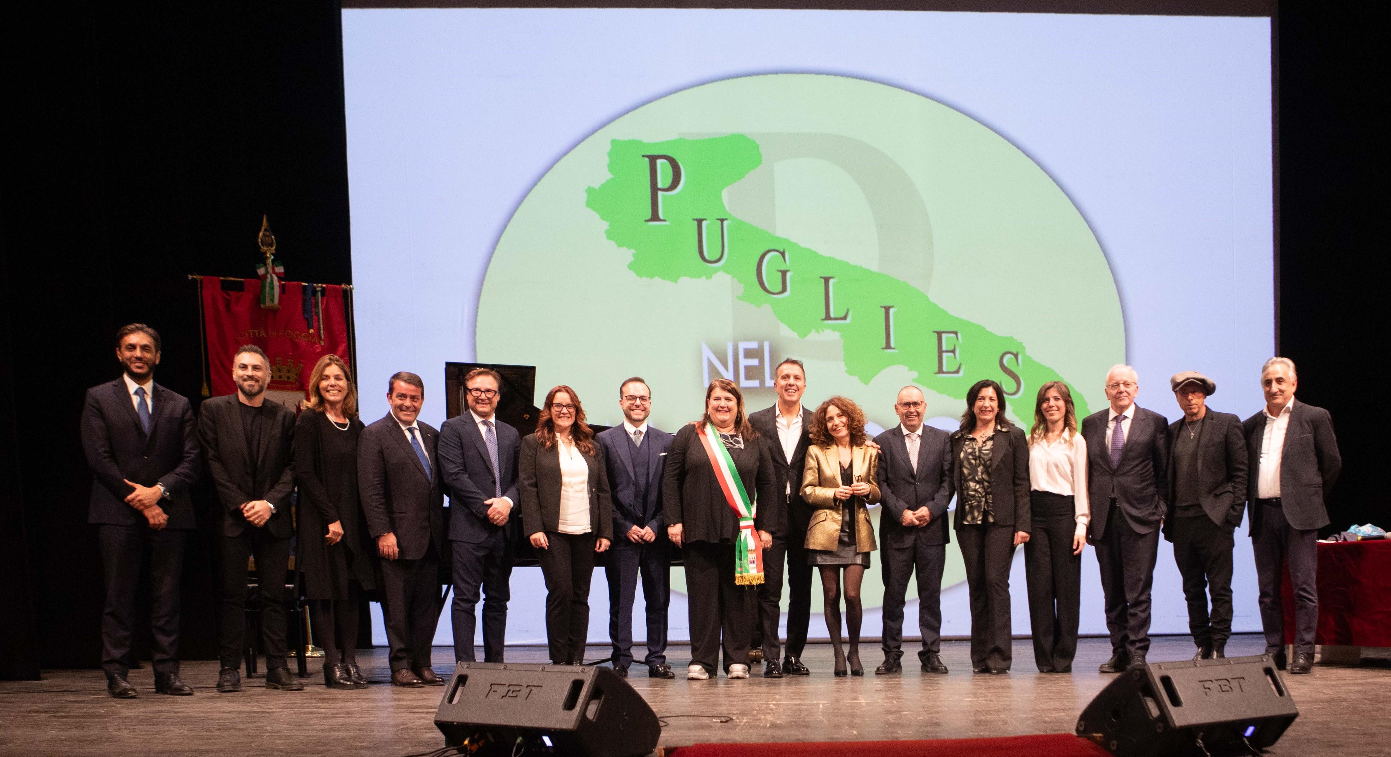 A group of researchers standing on stage after receiving a prize for their work